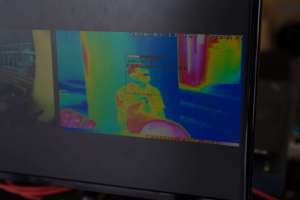 Monitor of thermographic image screening body temperature in the
